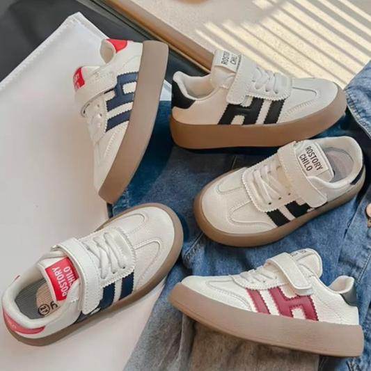 Stylish and comfortable unisex shoe, with great flexibility and a practical design with Velcro strap. - IRRAKIDS