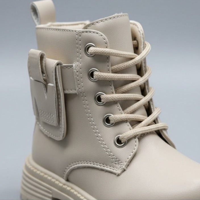 Girls' combat boots: snug lace-up fit, lugged sole — Product image: Playground-ready lugged outsoles reduce slips, while adjustable laces deliver a
