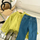 Stylish girls outfit with a modern touch - loose olive blouse with attractive pleated jeans - IRRAKIDS