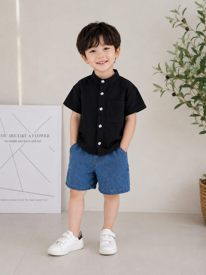 Stylish kids' outfit with a modern design, featuring a button-up shirt and denim shorts – perfect for a comfortable and coordinated look on sunny days!